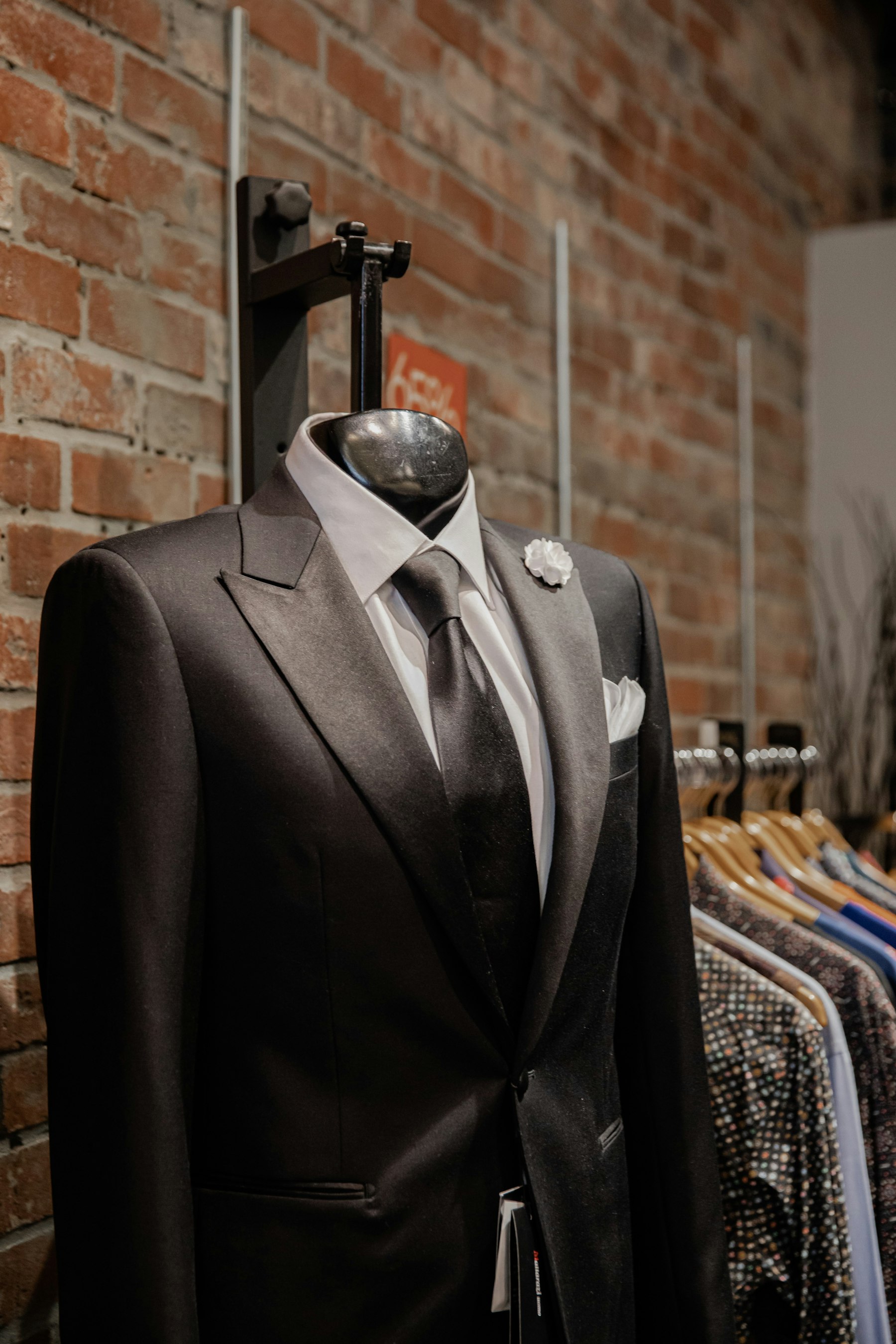 A suit jacket in progress on a tailor's form