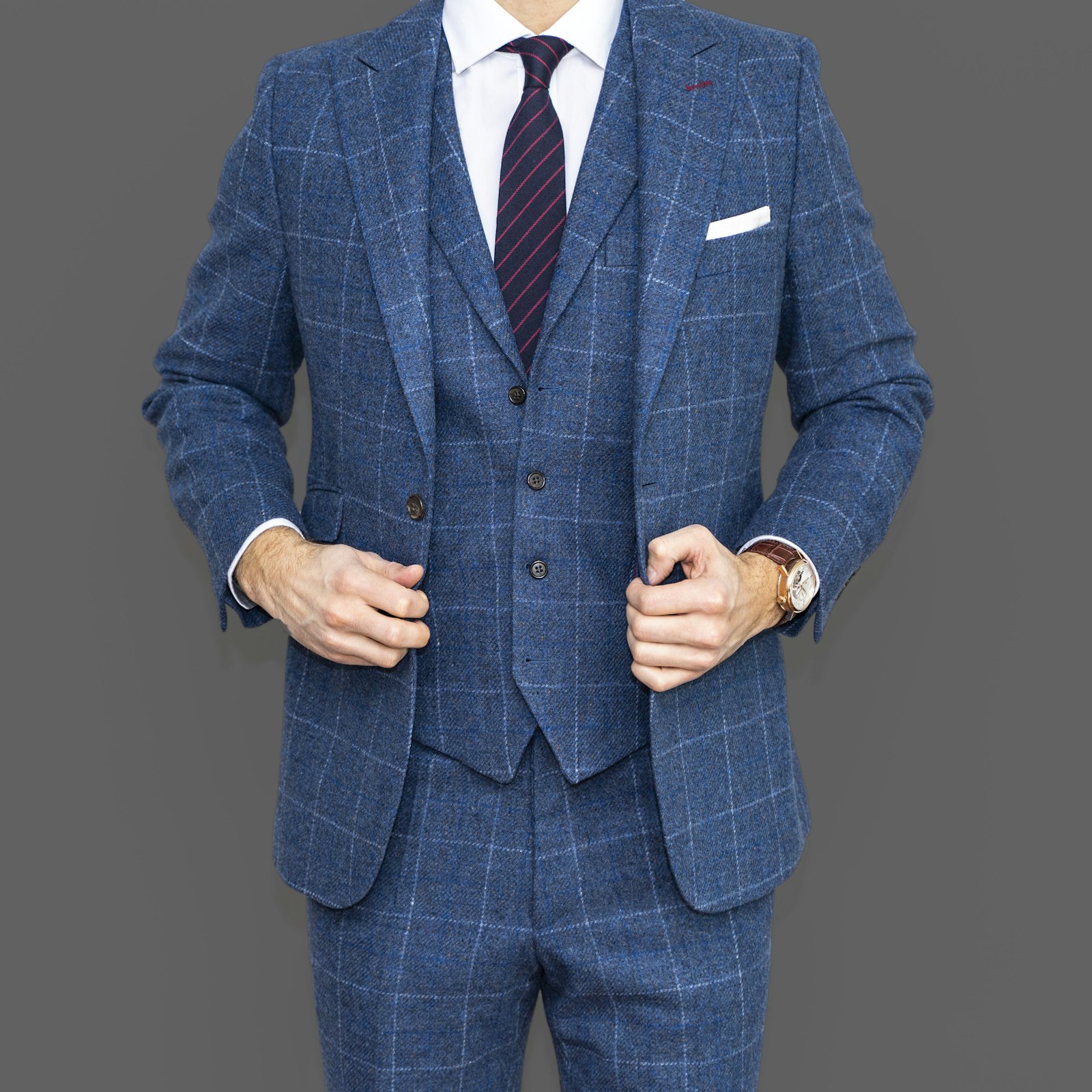 A three-piece suit in deep blue, properly fitted